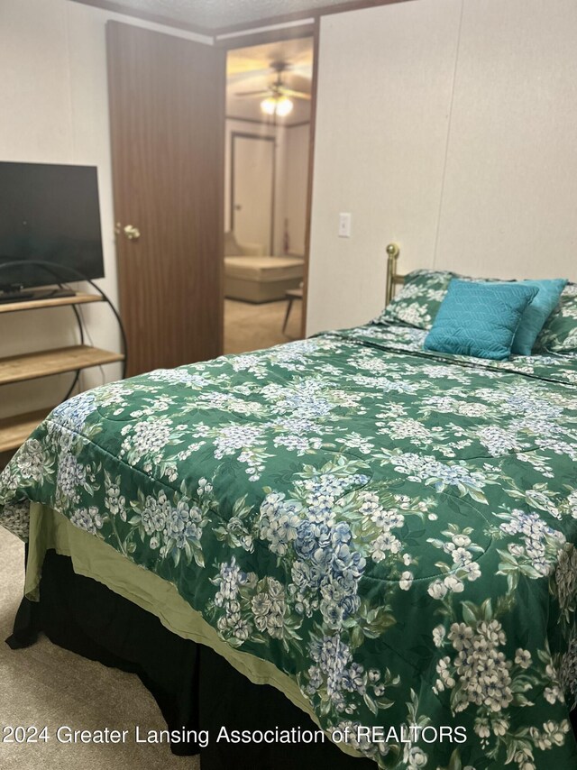 bedroom featuring crown molding and carpet floors