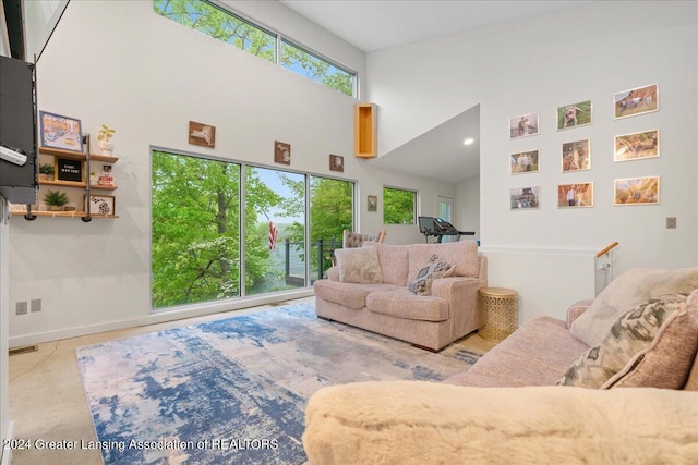 living room with high vaulted ceiling