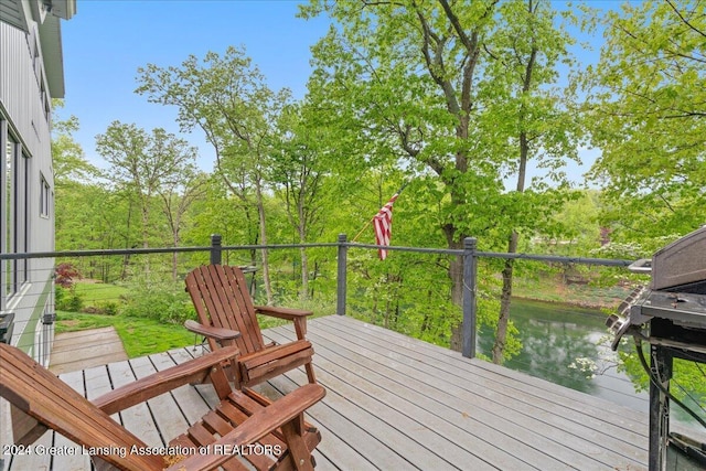 deck featuring a water view