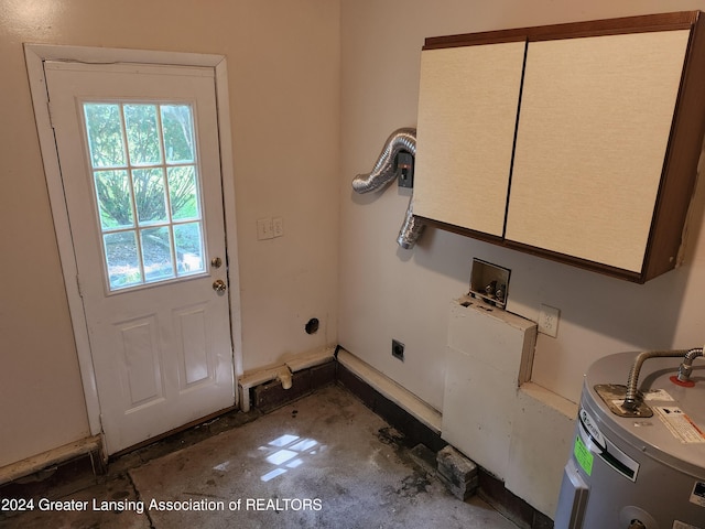 washroom with hookup for an electric dryer, water heater, cabinets, and hookup for a washing machine