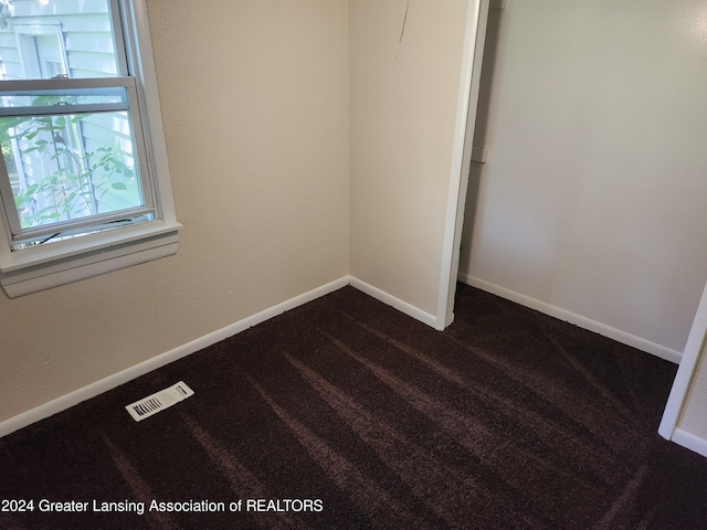 empty room featuring carpet floors