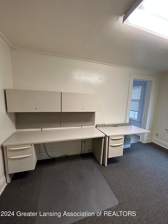 unfurnished office with carpet and built in desk