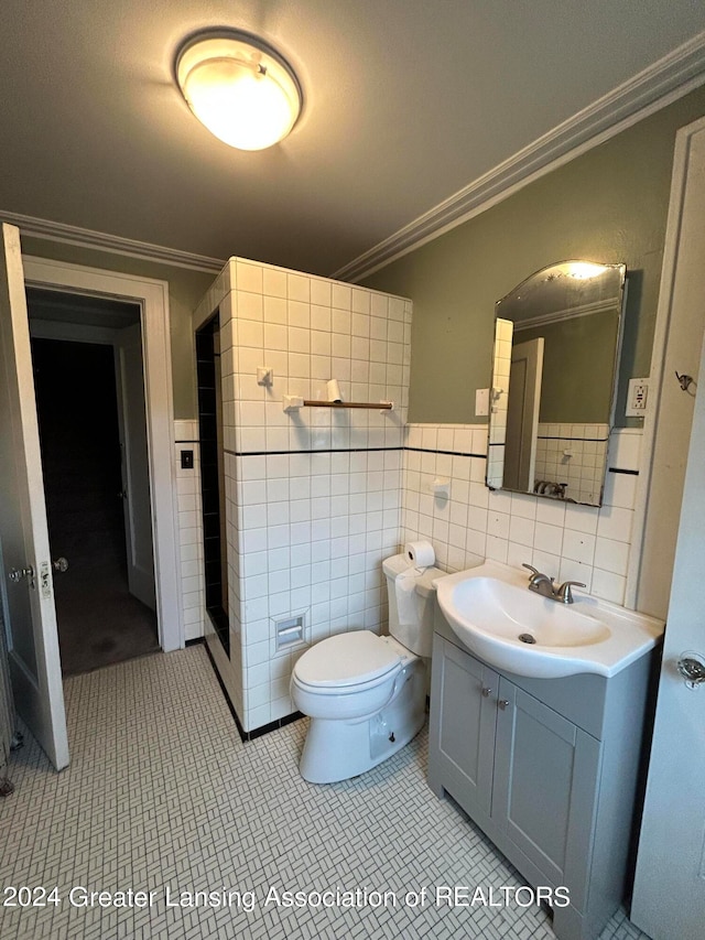 bathroom with tile walls, tile patterned flooring, backsplash, toilet, and vanity