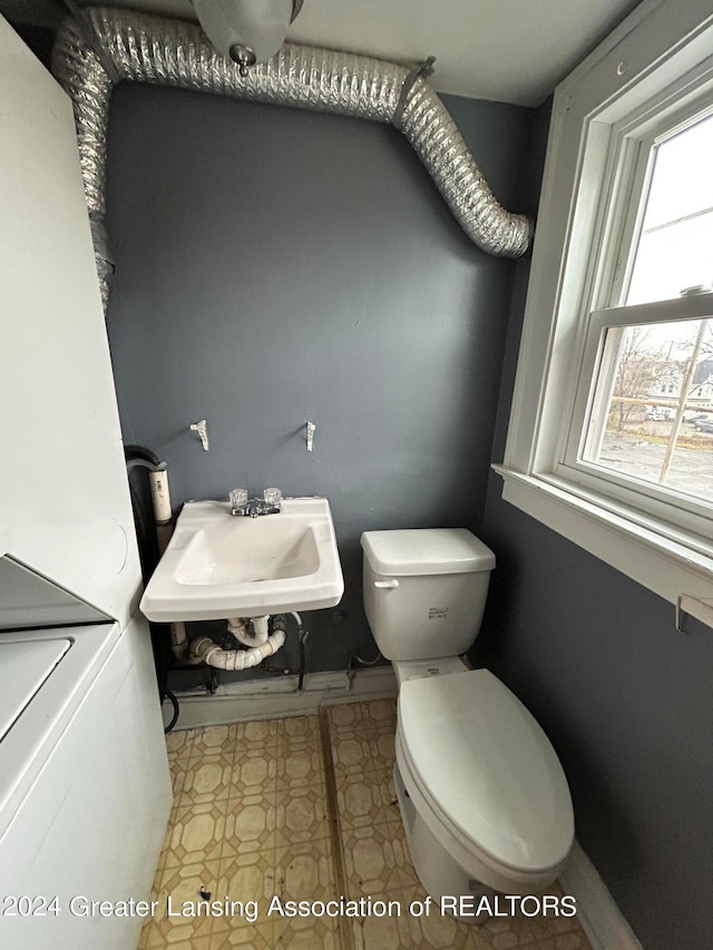 bathroom featuring tile patterned floors, toilet, and sink