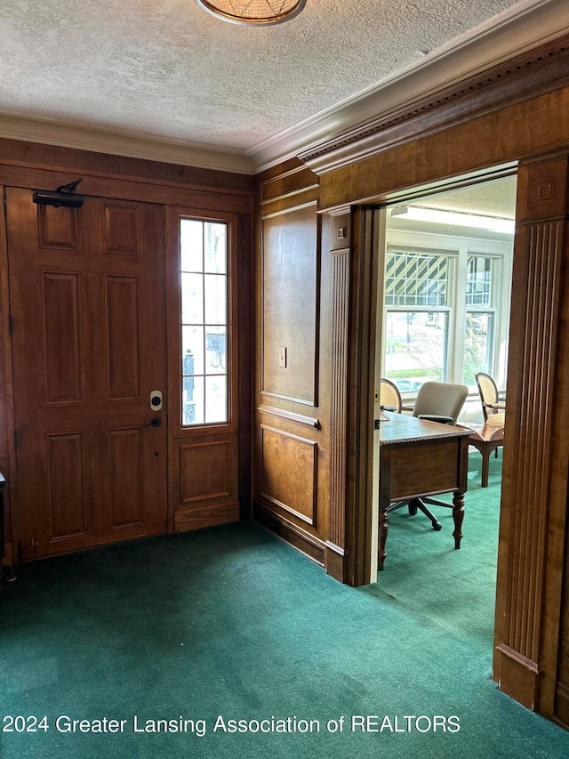 foyer entrance with a healthy amount of sunlight and dark carpet