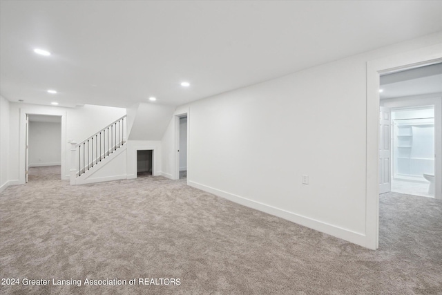 unfurnished living room with light carpet