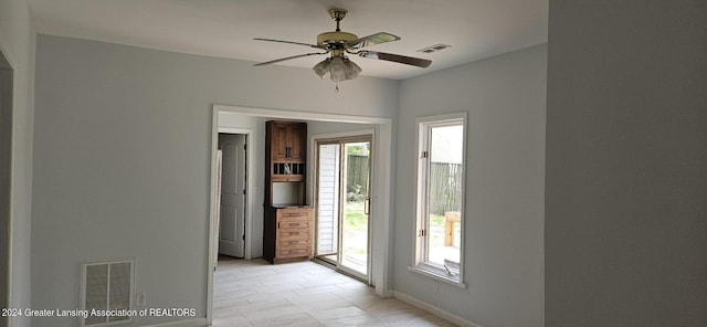 entryway featuring ceiling fan