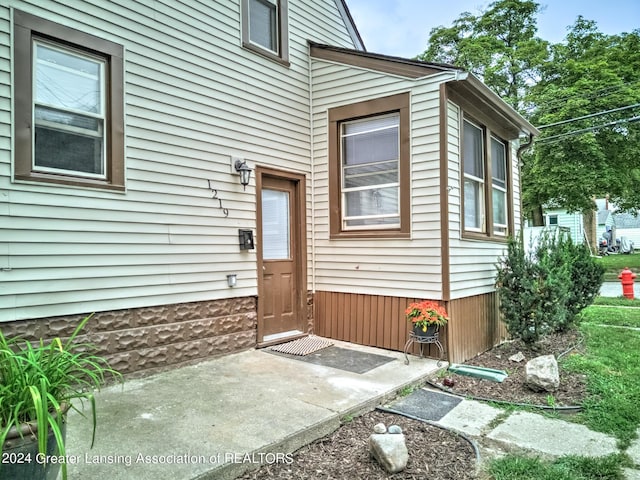 property entrance with a patio