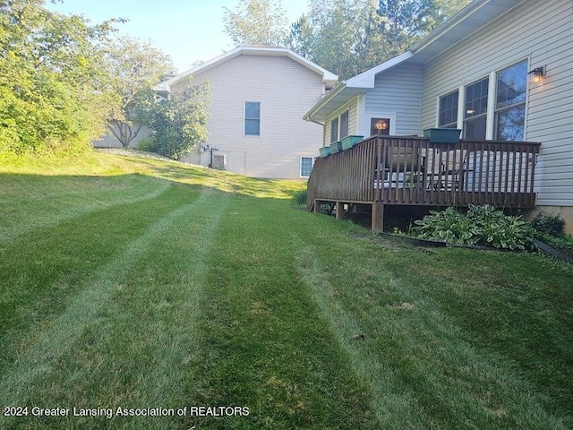 view of yard with a deck