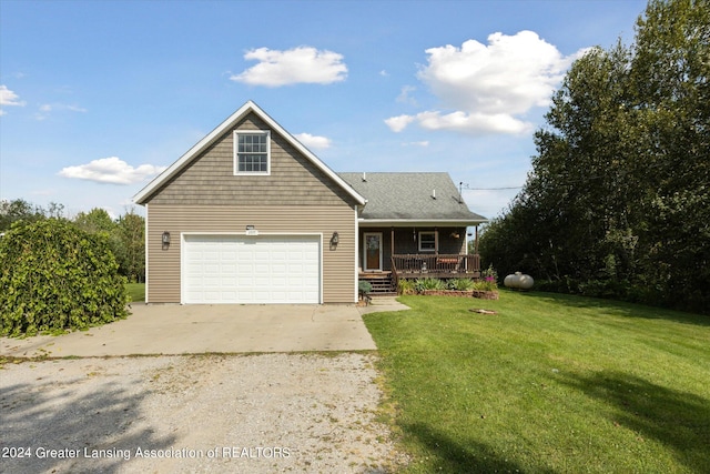 front of property with a garage, a porch, and a front yard