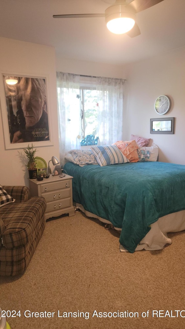 carpeted bedroom with ceiling fan