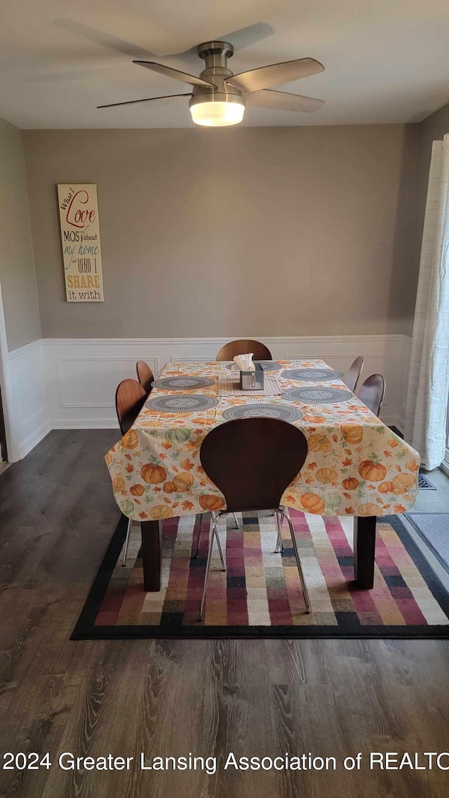 dining room featuring ceiling fan and dark hardwood / wood-style floors