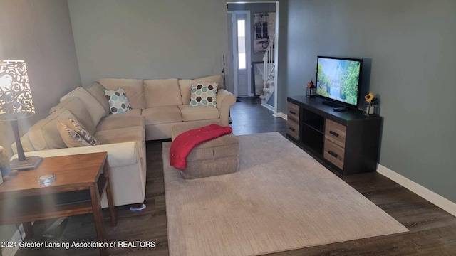 living room with dark hardwood / wood-style floors