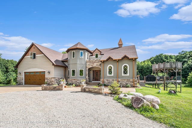 view of front of house with a garage and a front lawn