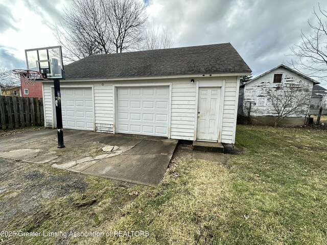 detached garage with fence