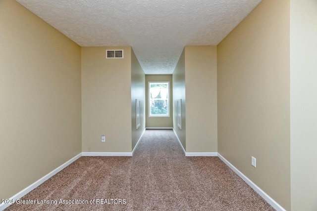 interior space with a textured ceiling