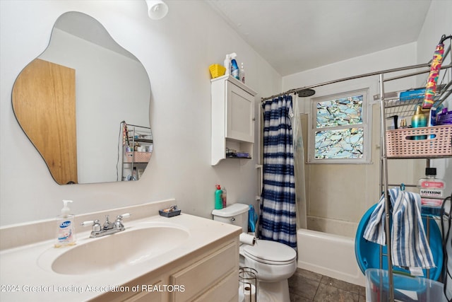 full bathroom featuring shower / bath combo, vanity, toilet, and tile patterned floors