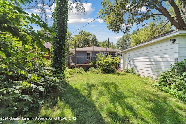 view of yard with a wooden deck