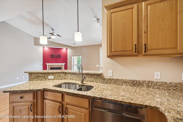 kitchen featuring stainless steel dishwasher, sink, light stone countertops, a textured ceiling, and ceiling fan