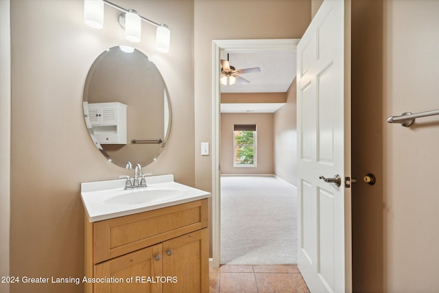 bathroom featuring ceiling fan, tile patterned floors, and vanity