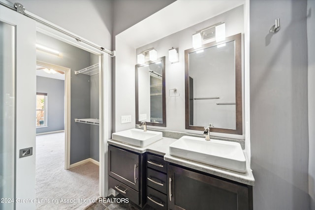 bathroom with dual bowl vanity