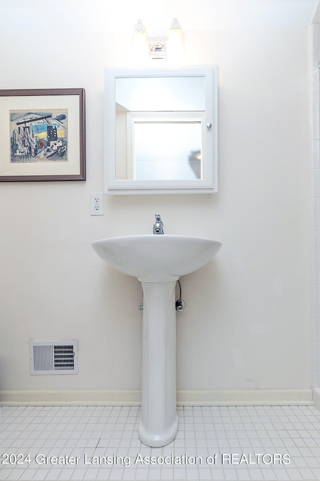 bathroom with tile patterned floors