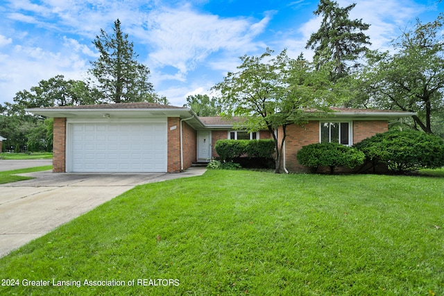 single story home with a garage and a front yard