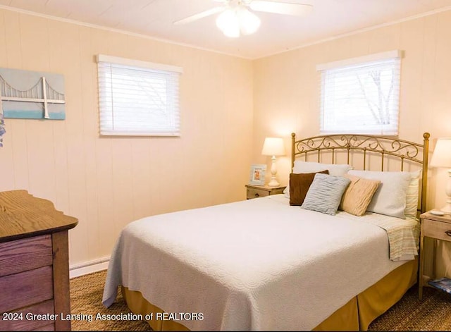 bedroom with ornamental molding, a baseboard radiator, and a ceiling fan