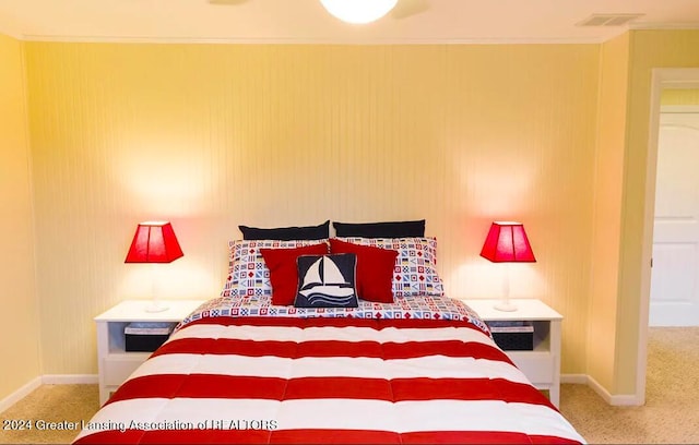 bedroom with baseboards, visible vents, and carpet flooring