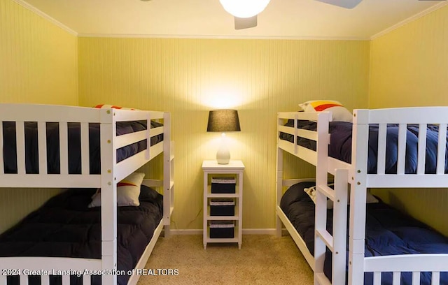 bedroom featuring crown molding and baseboards