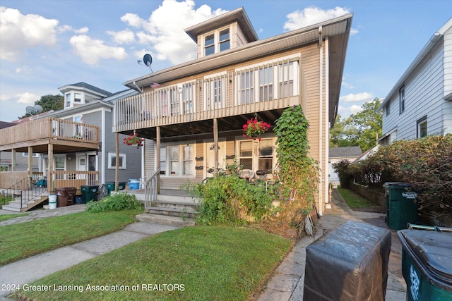 view of front of house with a balcony