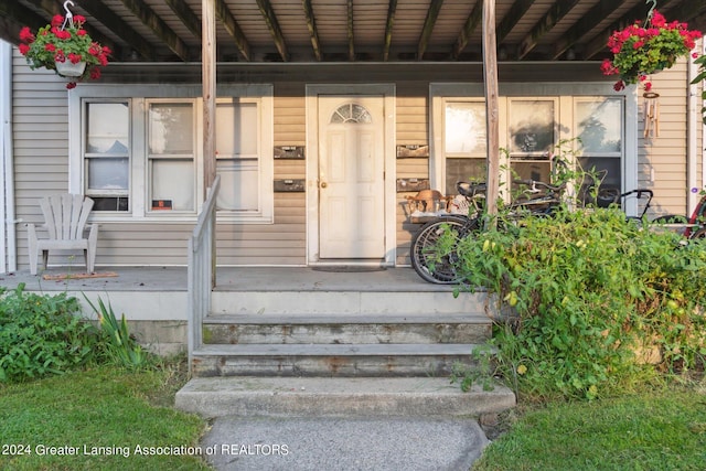 doorway to property with a porch