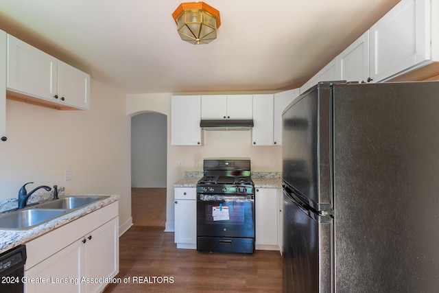 kitchen with arched walkways, under cabinet range hood, a sink, white cabinets, and black appliances