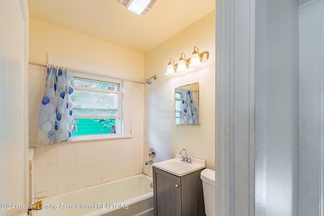 bathroom featuring washtub / shower combination, visible vents, vanity, and toilet