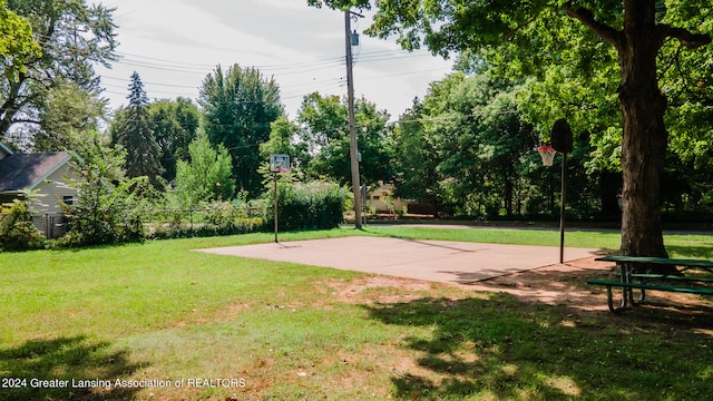 view of yard featuring basketball court