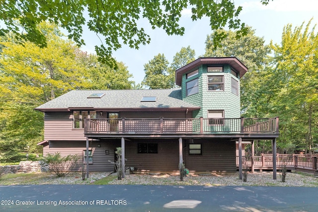 view of front of home featuring a wooden deck