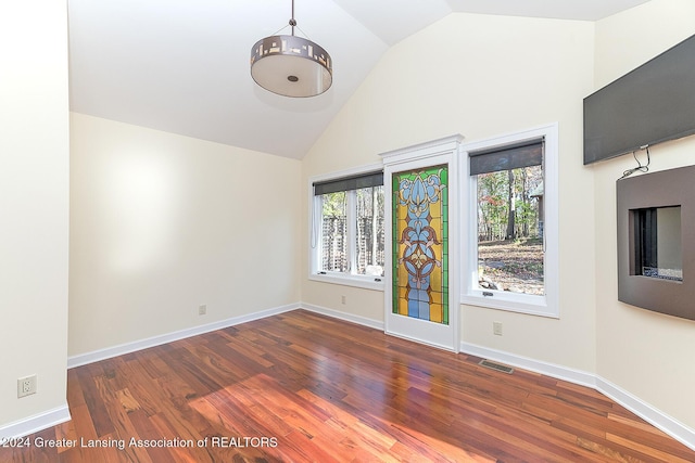 8425 Oakside St, Portage, MI 49002 - spare room with healthy amount of natural light, wood finished floors, baseboards, and high vaulted ceiling