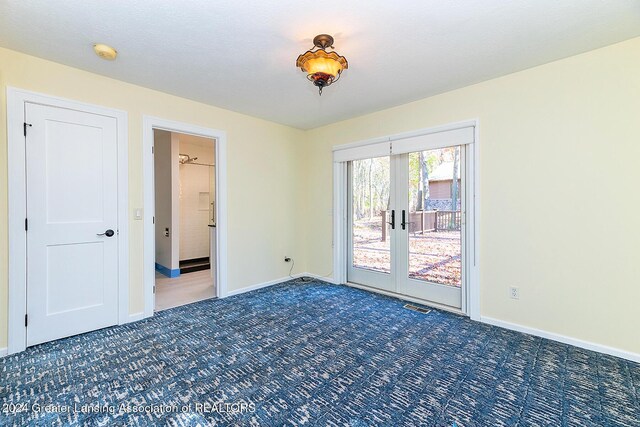 8425 Oakside St, Portage, MI 49002 - carpeted spare room featuring a smoke detector, french doors, and baseboards