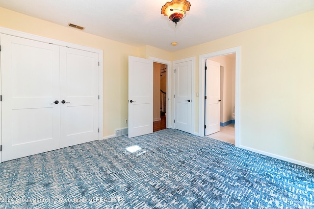 unfurnished bedroom featuring a closet