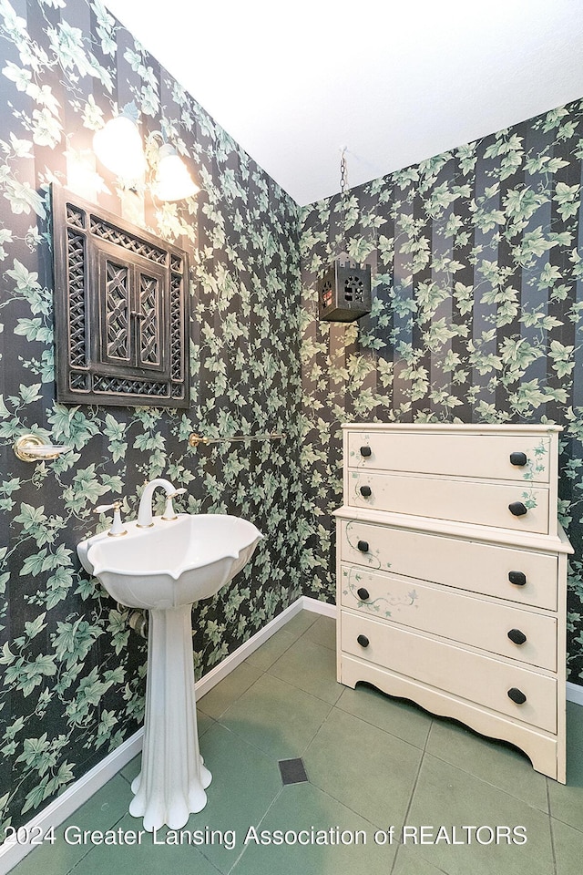 8425 Oakside St, Portage, MI 49002 - bathroom with baseboards, tile patterned flooring, and wallpapered walls