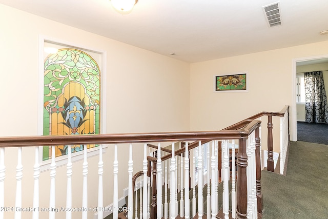 hall with carpet and plenty of natural light