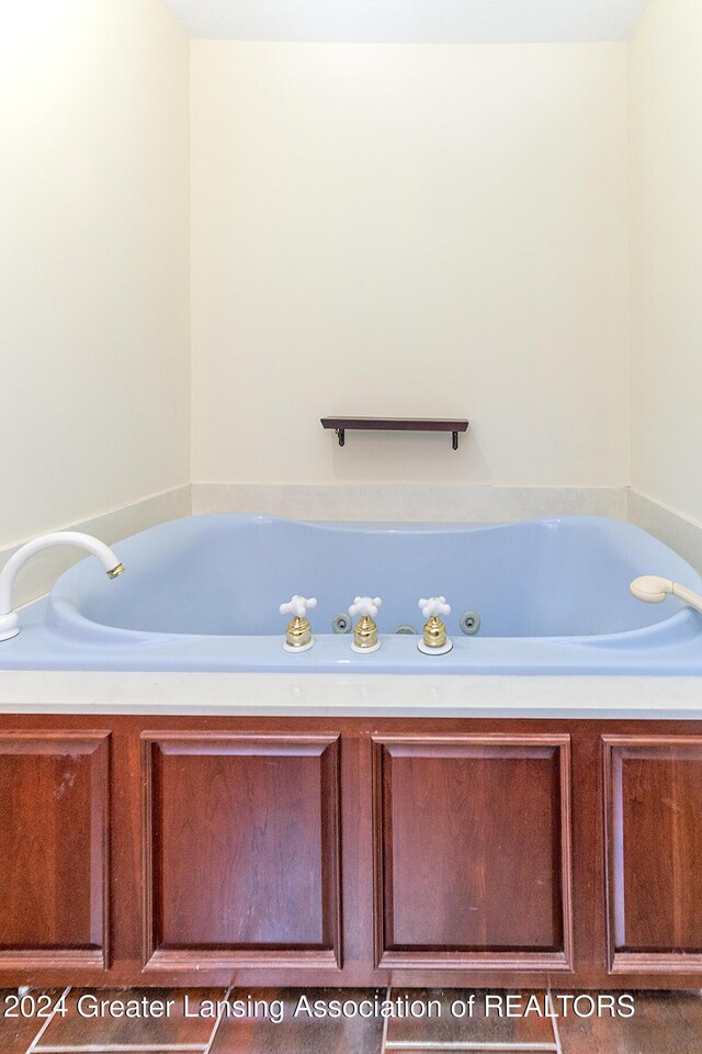 8425 Oakside St, Portage, MI 49002 - bathroom featuring a whirlpool tub