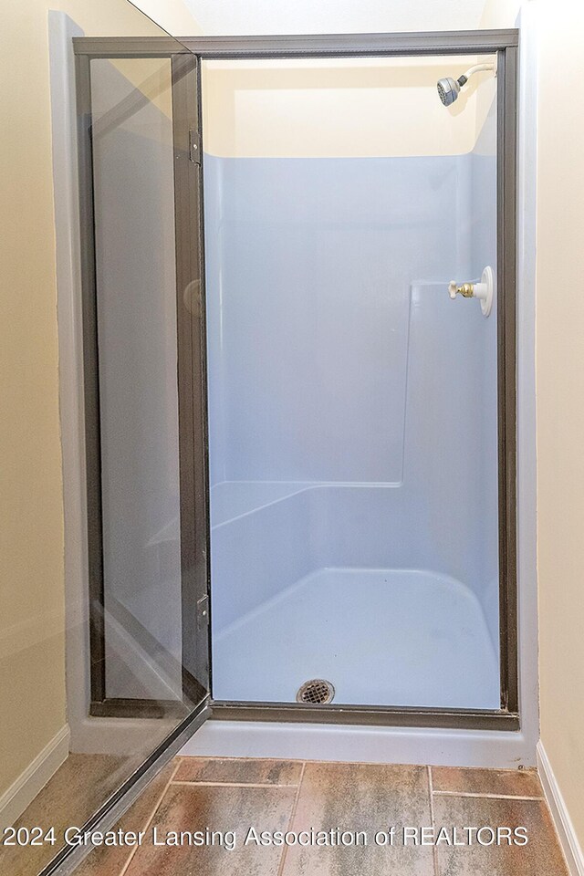 8425 Oakside St, Portage, MI 49002 - full bathroom with a shower stall and baseboards