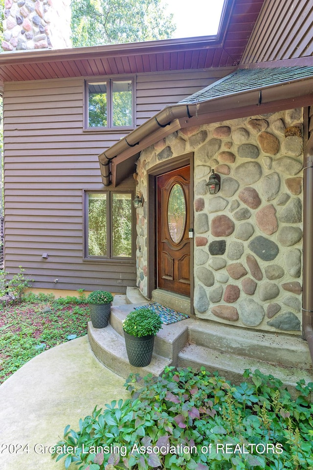 8425 Oakside St, Portage, MI 49002 - view of exterior entry featuring stone siding