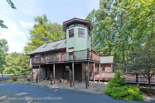 8425 Oakside St, Portage, MI 49002 - view of front of house with a wooden deck and a shingled roof