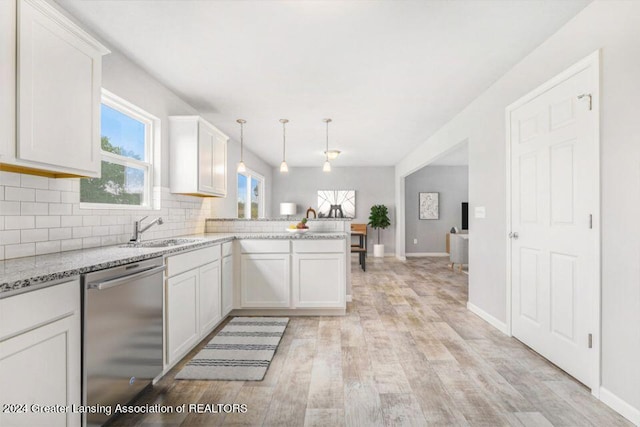 kitchen featuring dishwasher, decorative light fixtures, kitchen peninsula, and white cabinets