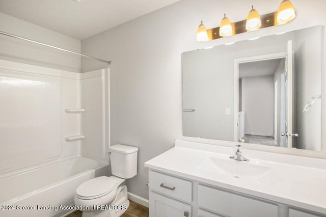 full bathroom with vanity, shower / bathtub combination, and toilet