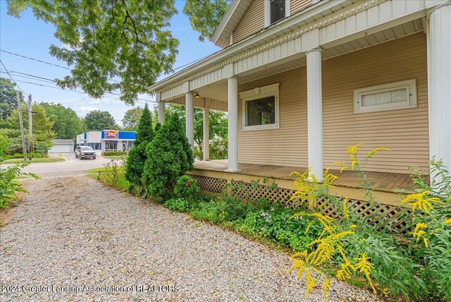 view of home's exterior with covered porch