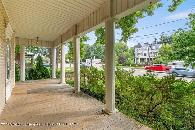 wooden terrace featuring covered porch