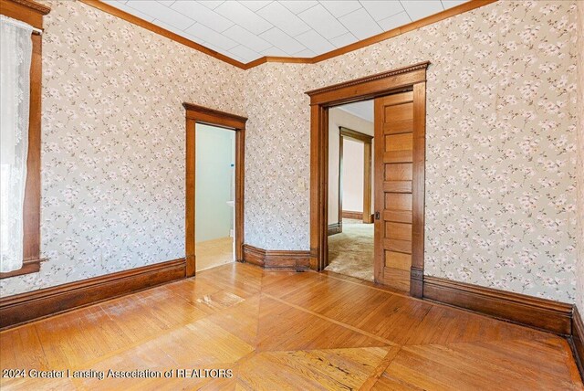 spare room featuring ornamental molding